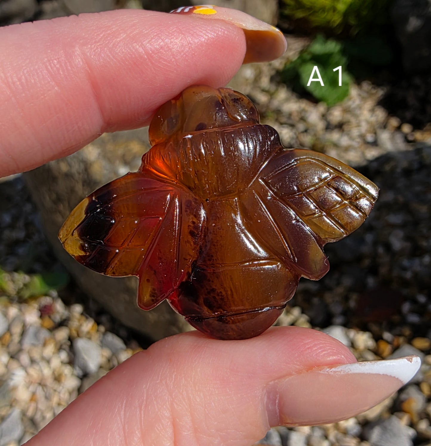 Blue Amber carved bees